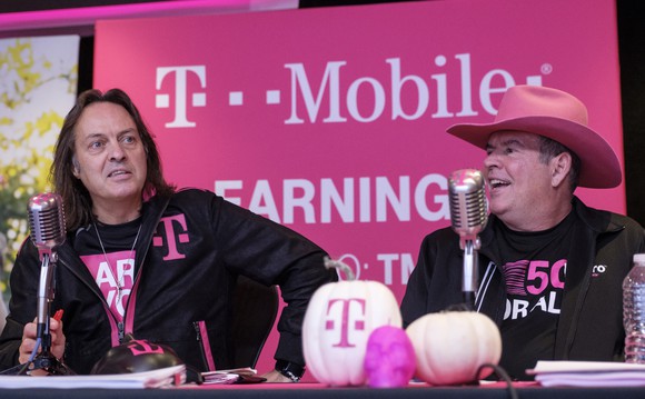 T-Mobile CFO Braxton Carter alongside CEO John Legere.