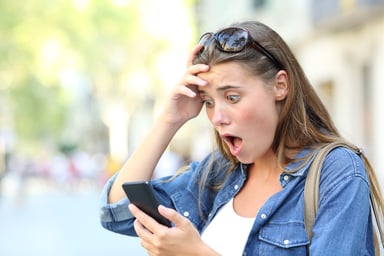 shocked woman phone online dating match getty