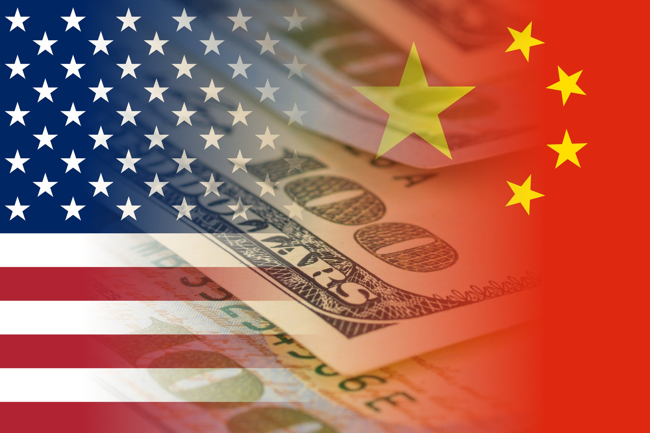 Overlay of the U.S. flag, Chinese flag, and $100 bill
