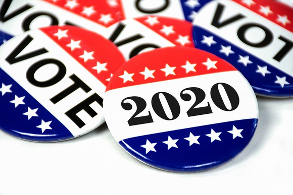Election pins read "vote" and "2020"