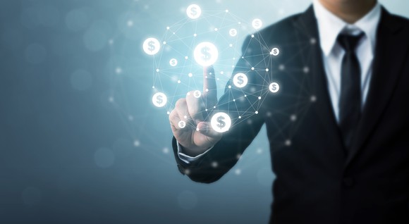 Businessman pointing to dollar sign images