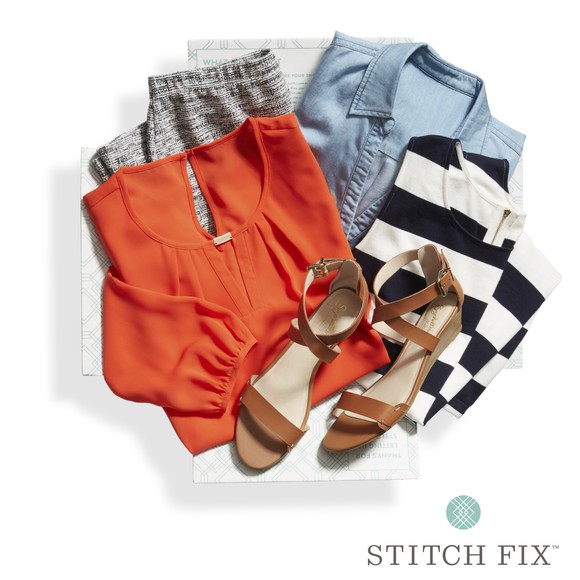 A sample of a Stitch Fix box that includes an orange top and brown sandals.