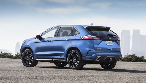 A blue Ford Edge ST, a high-performance midsize crossover SUV.