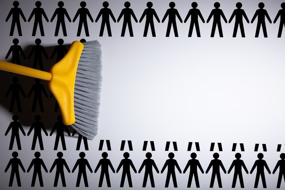 Images of workers being swept away by a broom.