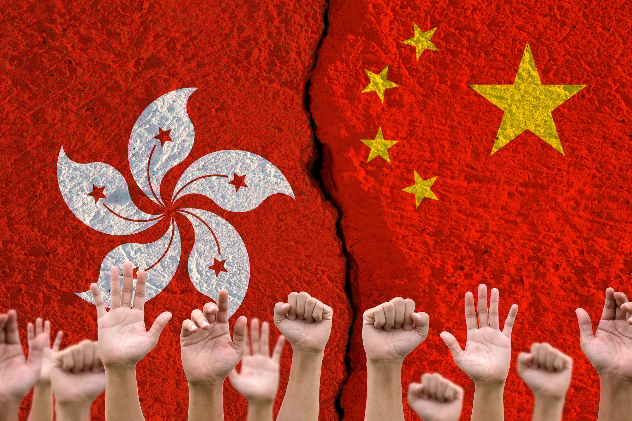 Raised hands with the flags of Hong Kong and China in the background.