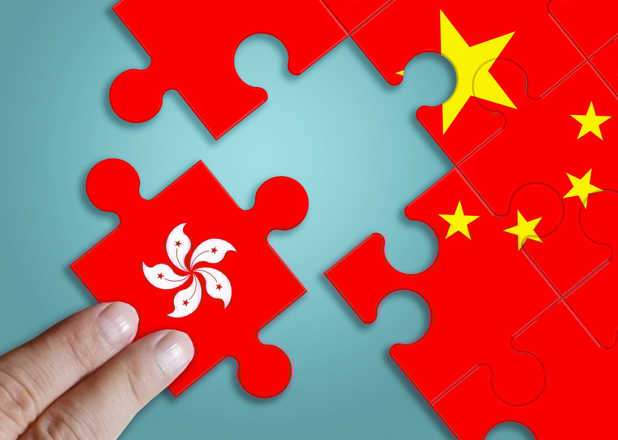 A jigsaw puzzle of the Chinese flag with a piece representing Hong Kong removed