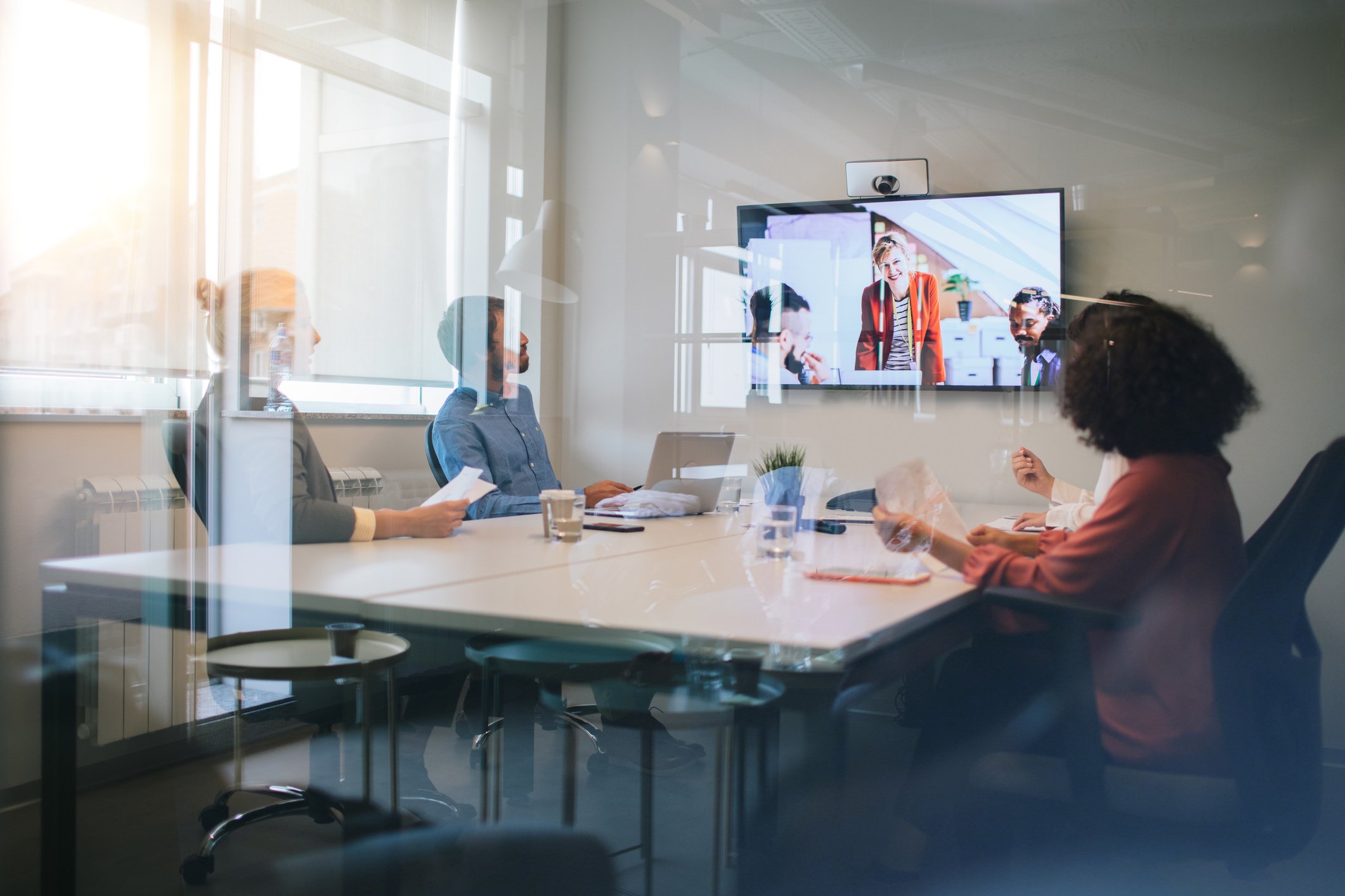 Company meeting including participants on a video conference