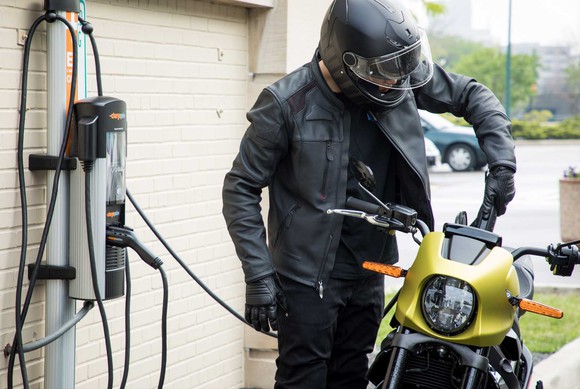 Motorcyclist charging the Harley-Davidson LiveWire