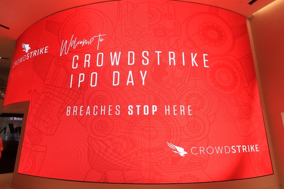 Red screen with Crowdstrike IPO day slogan and other text.