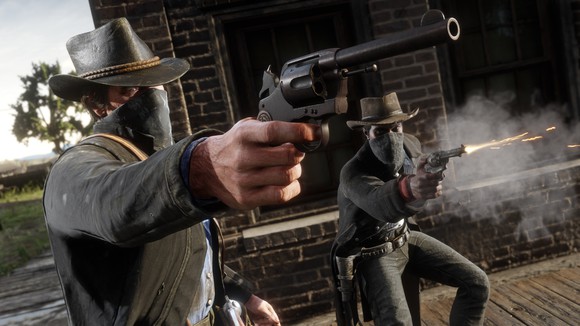 A screenshot of Take-Two's "Red Dead Redemption 2" video game showing two characters dressed like cowboys firing a western-style revolver.