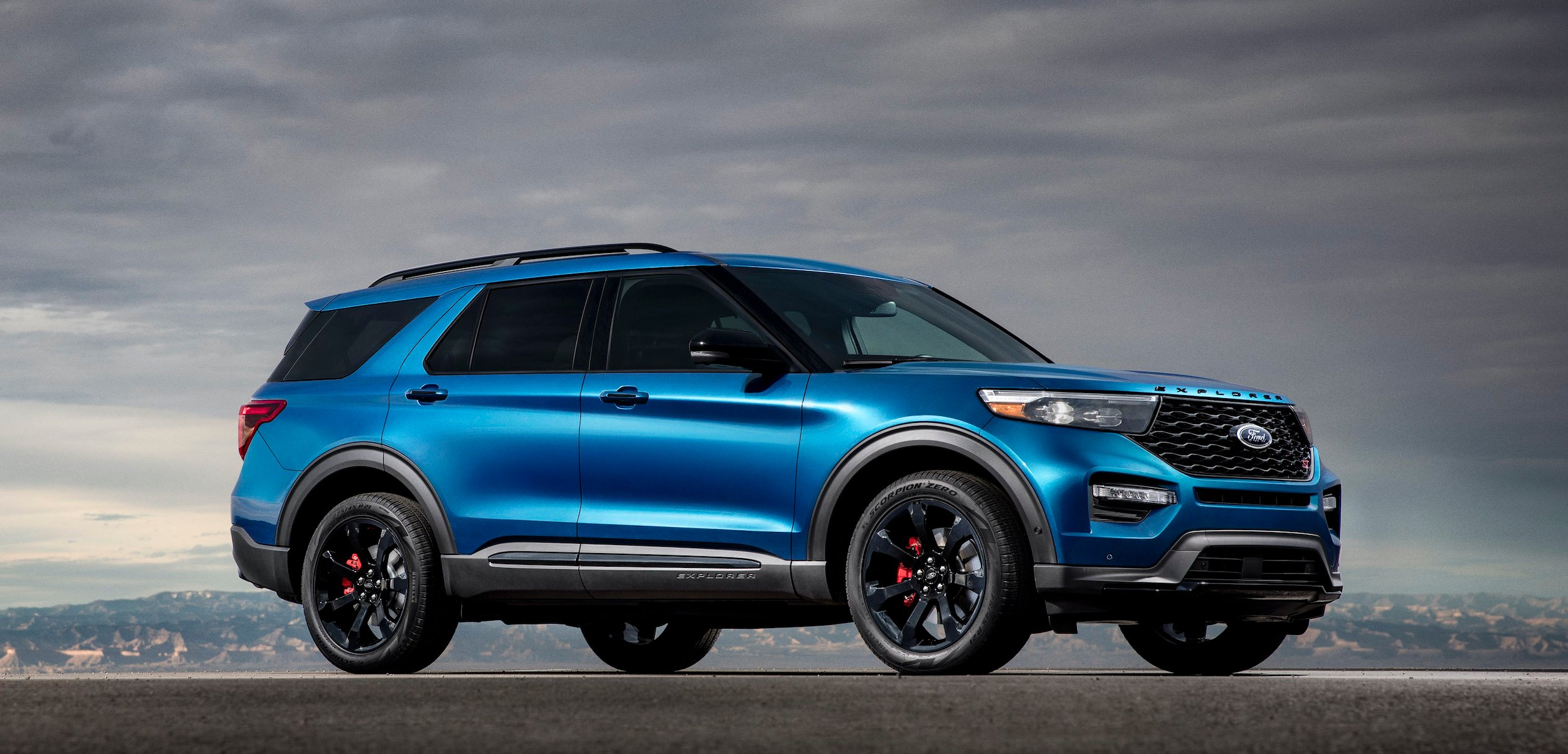 A blue 2020 Ford Explorer ST, a sporty seven-passenger crossover SUV