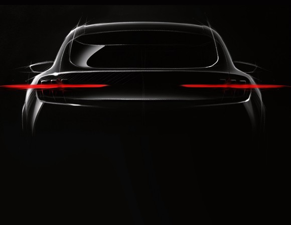 A Ford "teaser" photo of the upcoming electric SUV, showing Mustang-styled tail lights. 