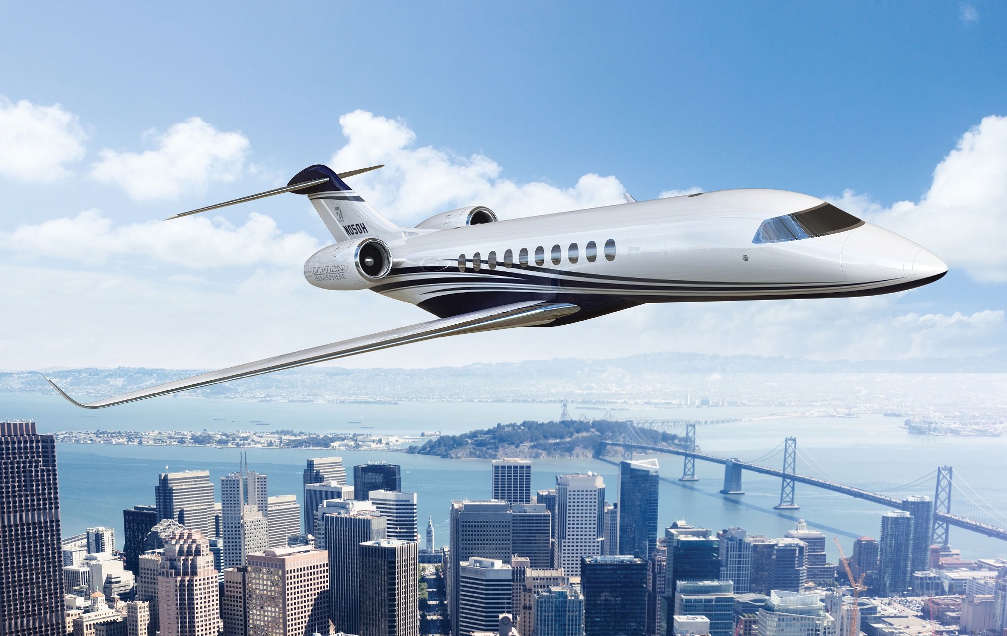 Textron Cessna jet flying with cityscape in the background.