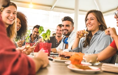 friends eating out fast casual restaurant getty