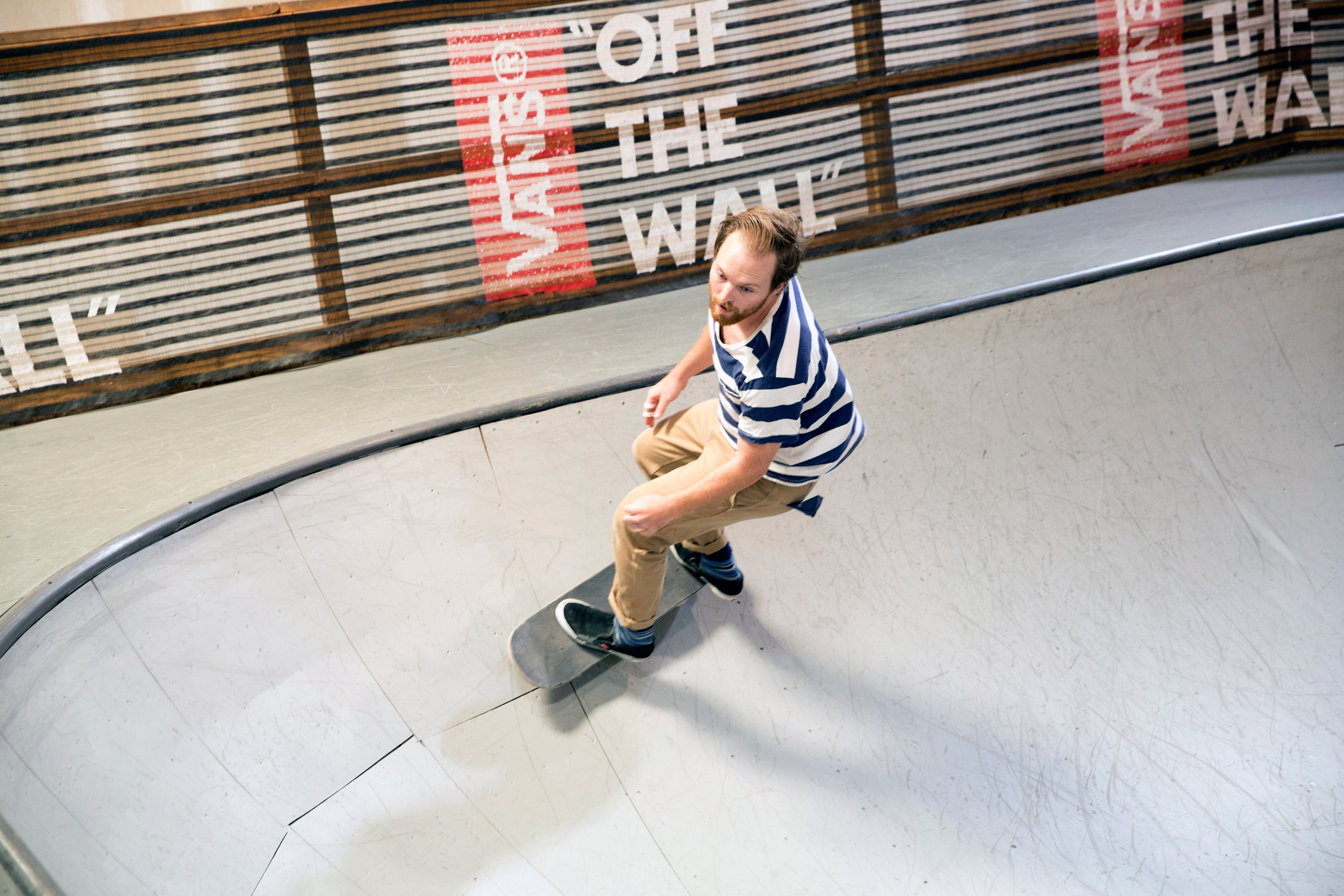 Man on skateboard in skateboard park.