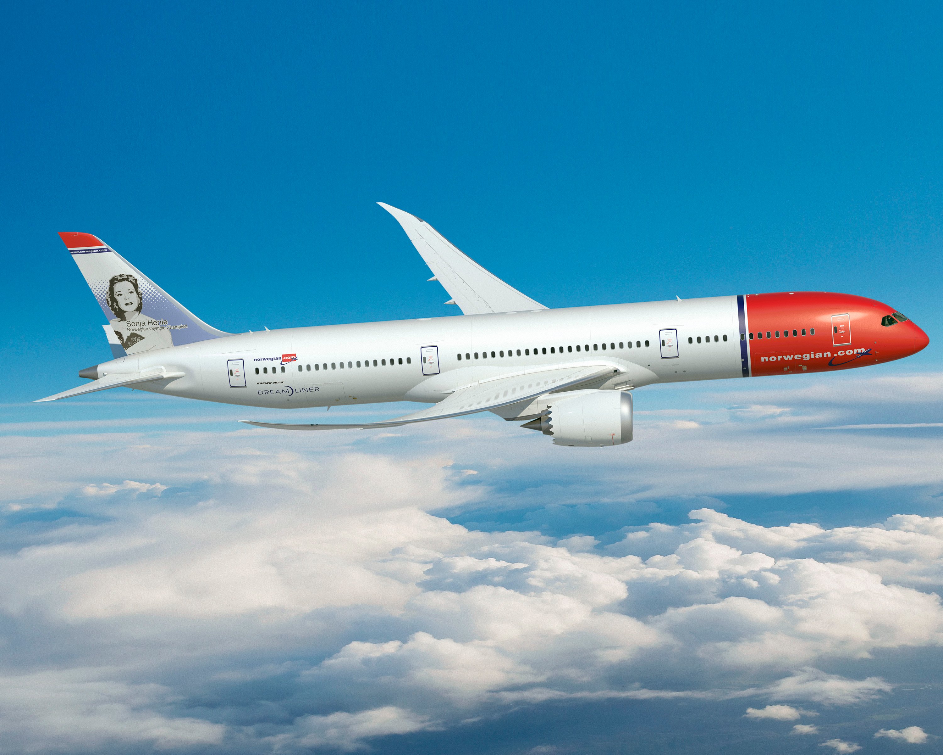 A Norwegian 787-9 flying over clouds.