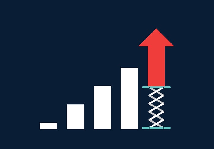 An ascending bar chart with the last and tallest bar represented by a red arrow on a springboard.