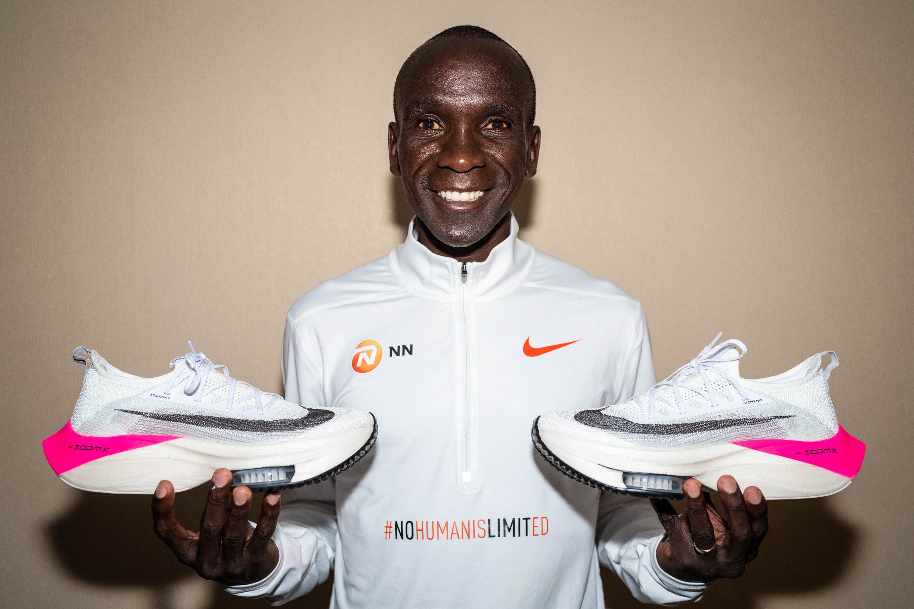 Runner Eliud Kipchoge holds a future version of Nike's NEXT% marathon shoe.