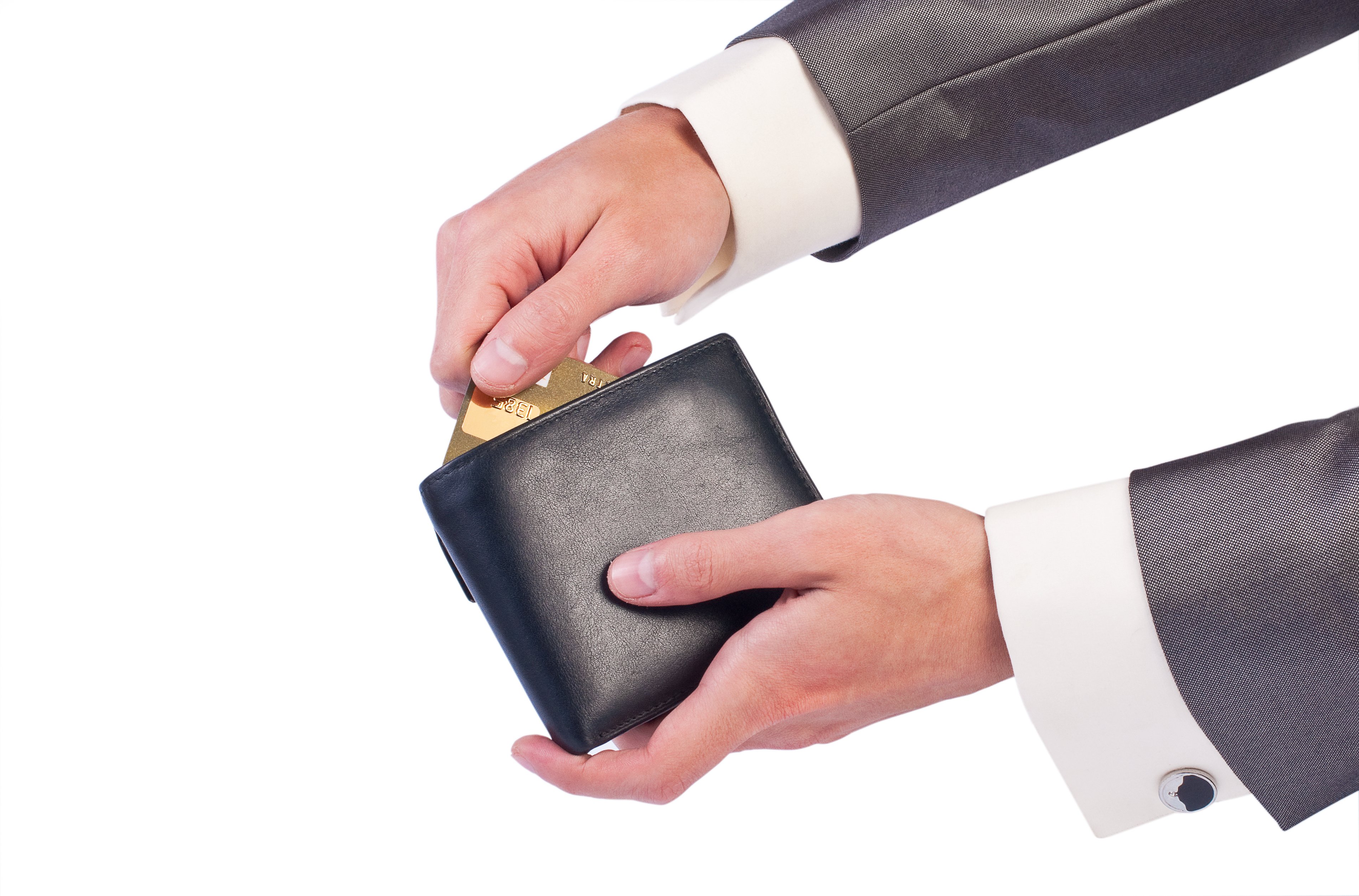 Businessman putting gold credit card into wallet