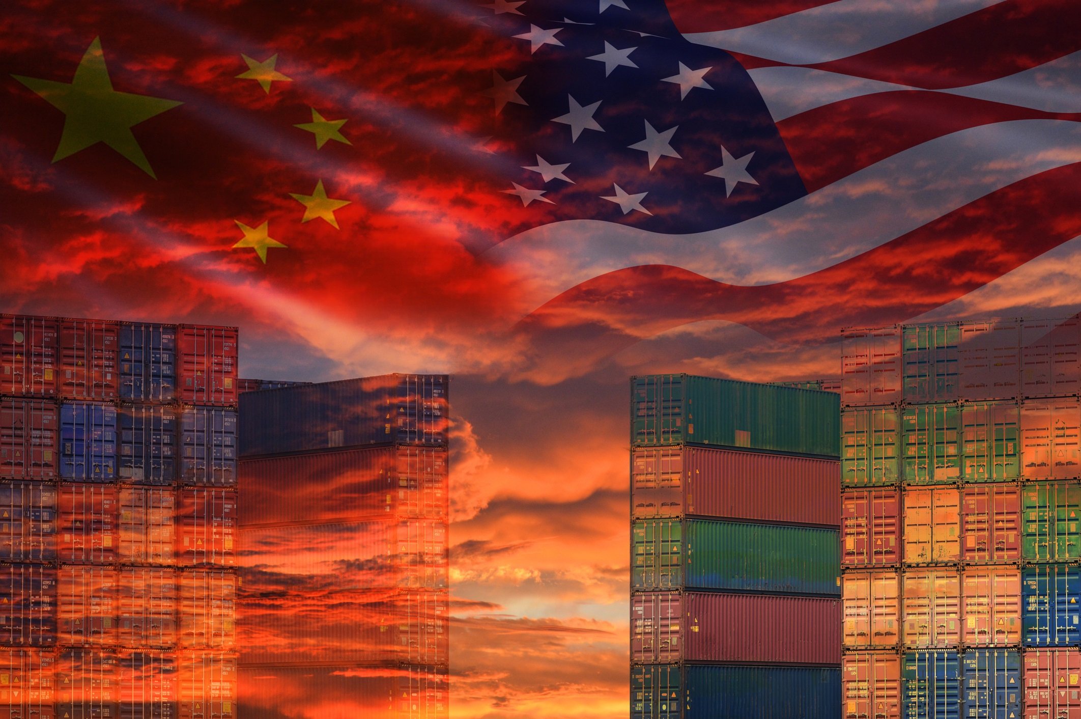 Silhouette of Chinese and American skyscrapers, with the flags of the U.S. and China hovering above