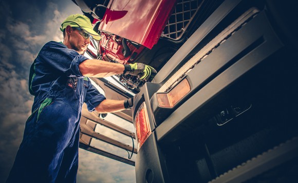 Man working on a semi truck