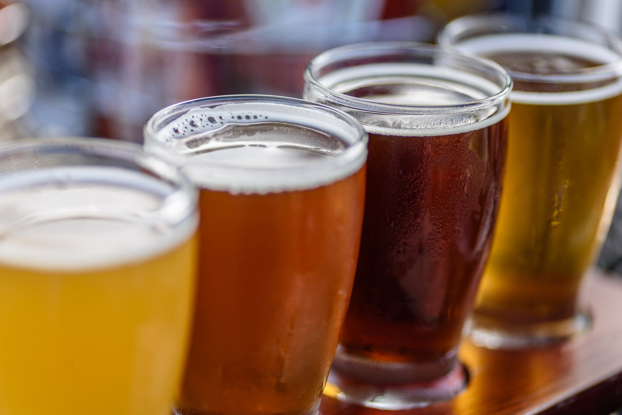 Close-up of a flight of beers (several small glasses for sampling).