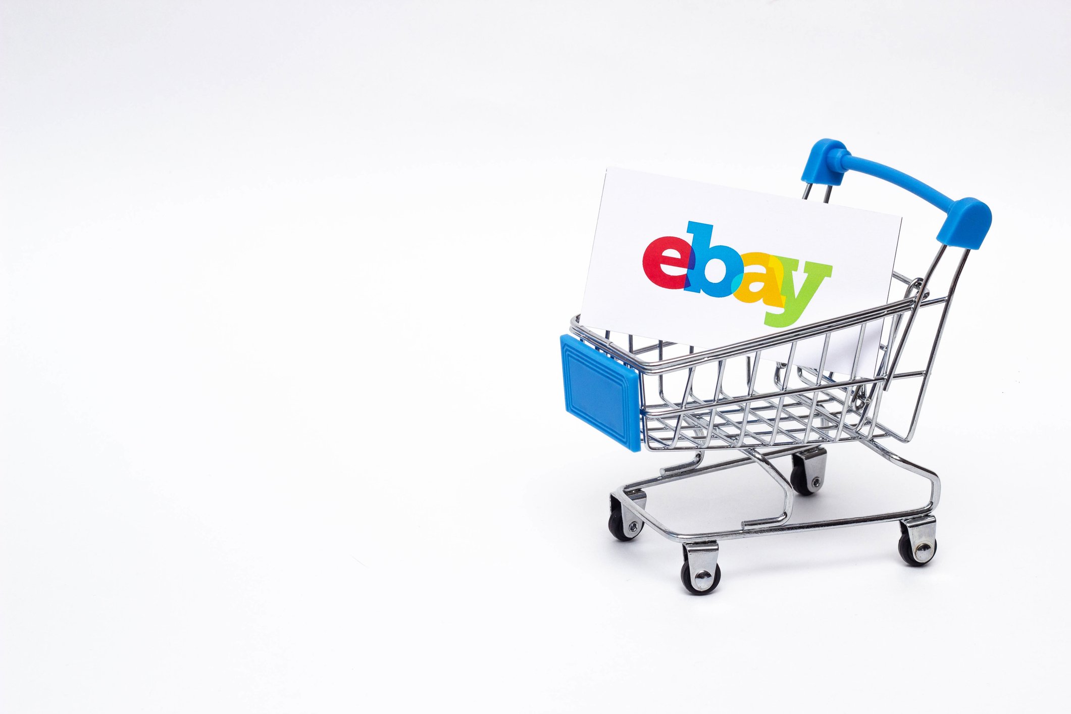 A shopping cart with an eBay branded box inside