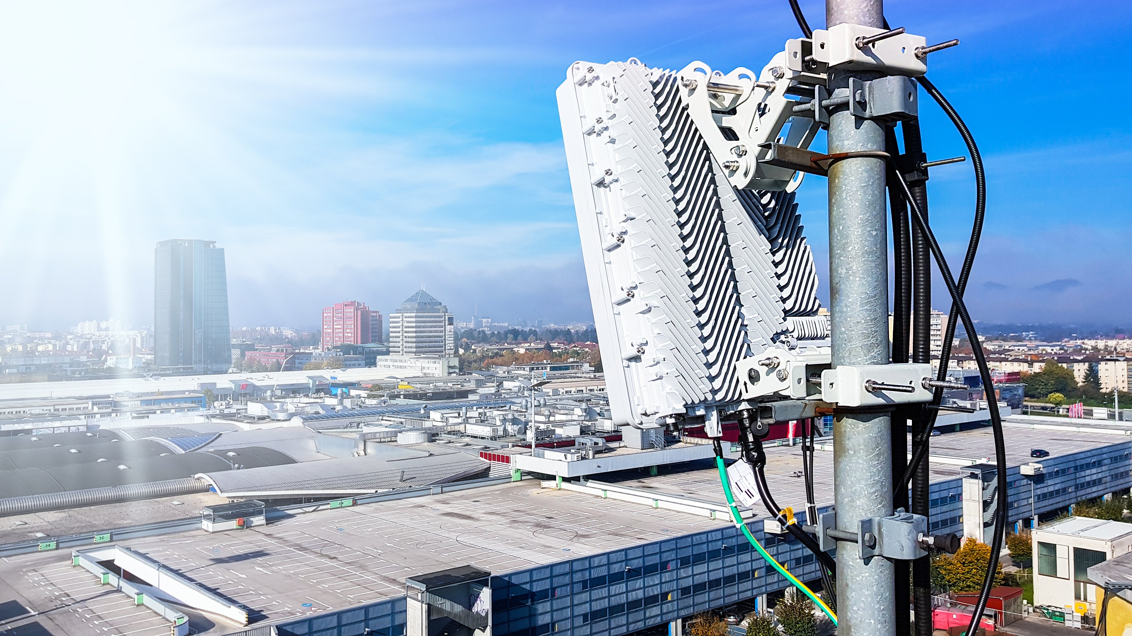Cellular antenna against the backdrop of a city.