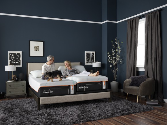 An elderly couple on a Tempur-Pedic mattress