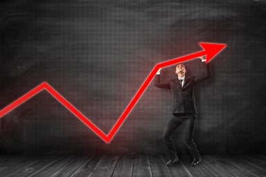 Businessman holding red line up