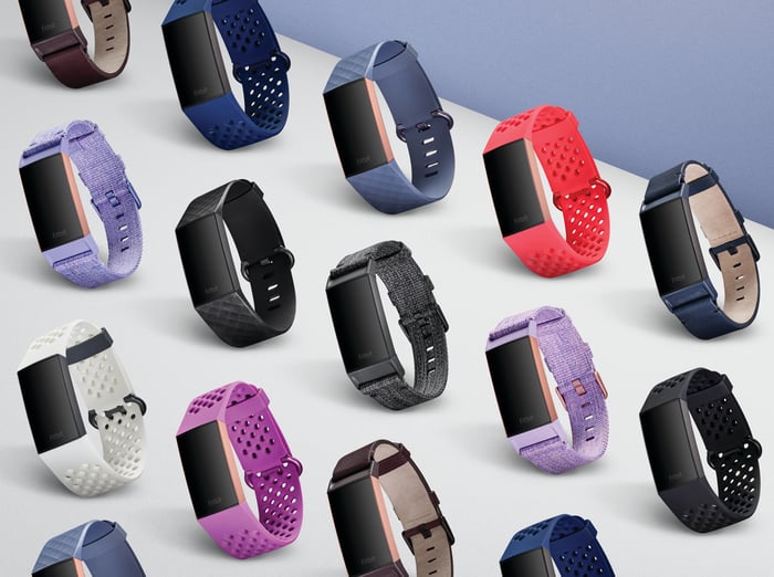 A lineup of Fitbits in various colors.