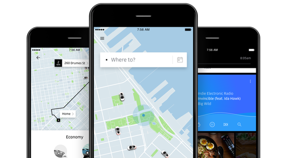 Uber app displayed on three smartphones