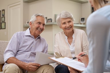 mature couple signing up for health insurance
