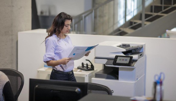 Woman using an HP printer