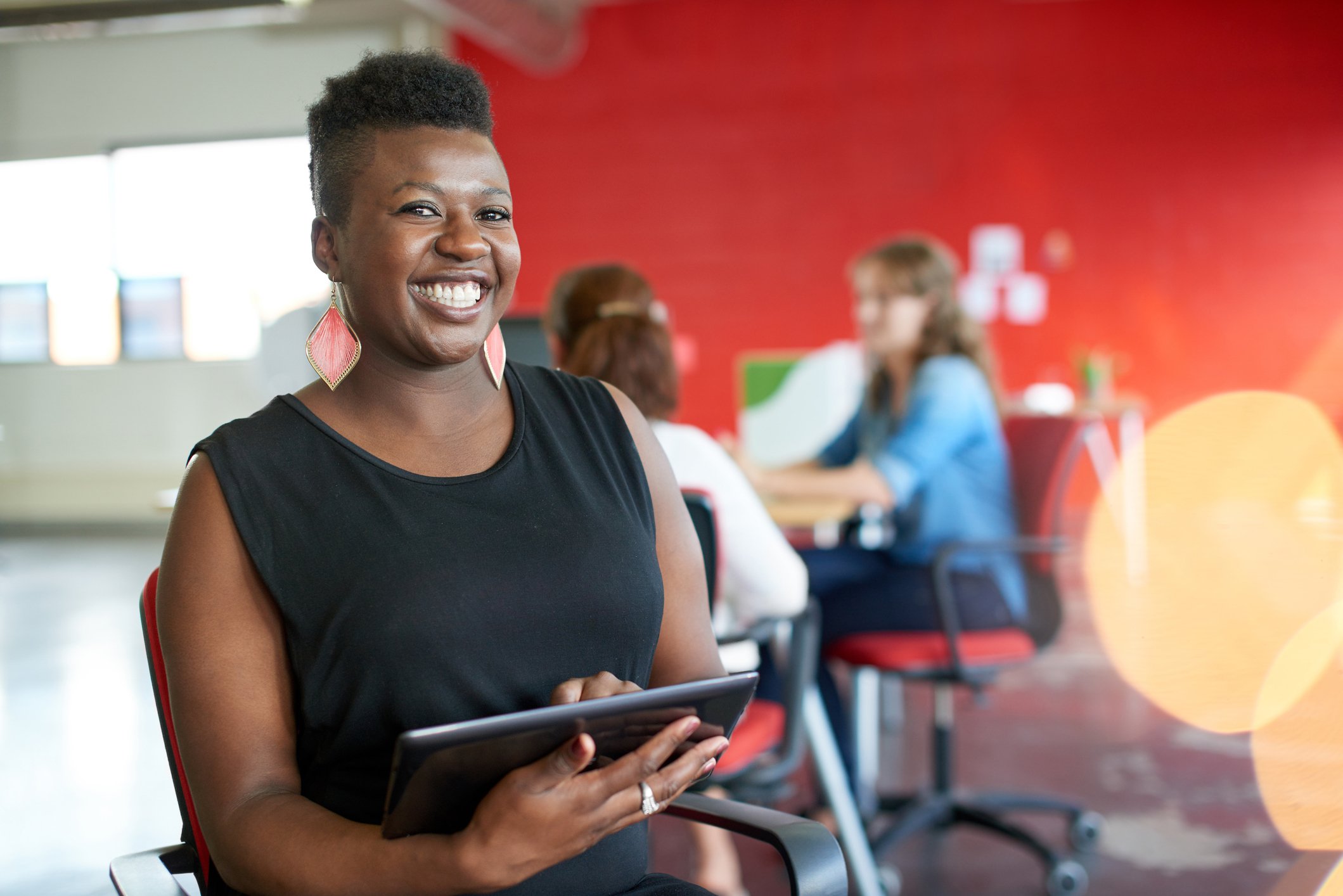 A woman using a tablet.