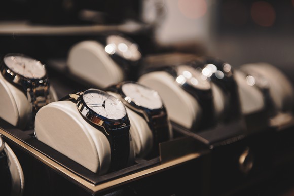 A row of watches in a retail store.