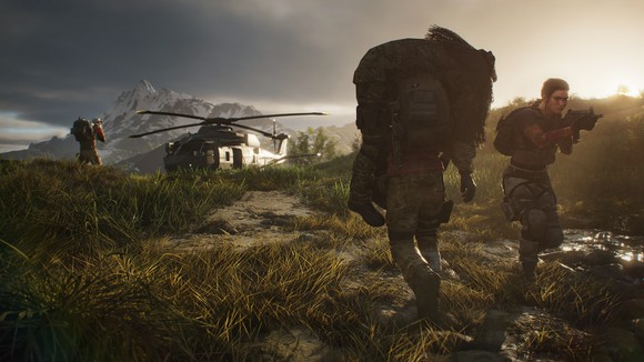 A soldier character carrying another character towards a helicopter in Ghost Recon: Breakpoint.