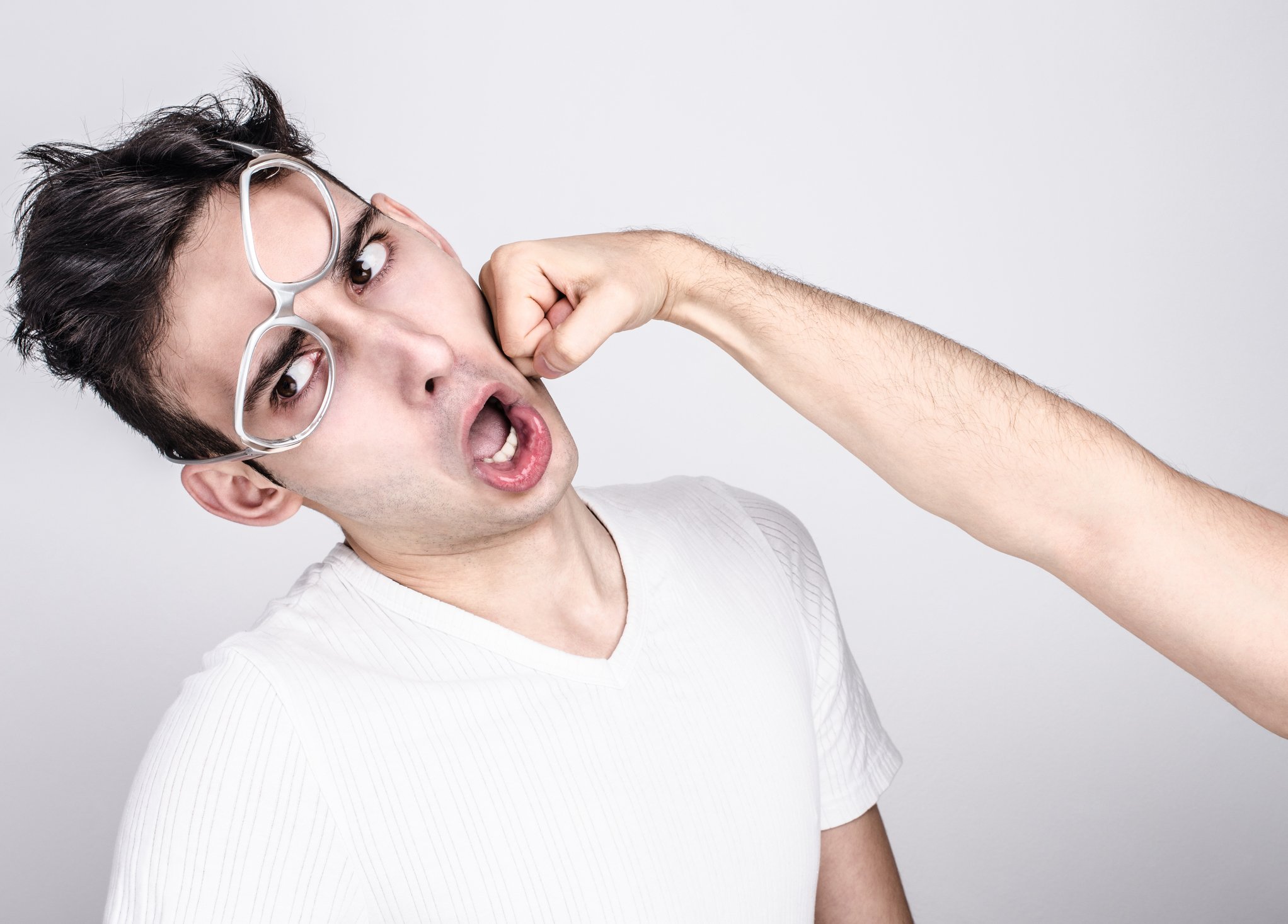 A man getting punched in the face.