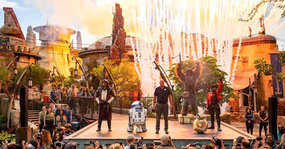 Costumed characters and park execs on stage during Disney World's opening of Star Wars: Galaxy's Edge.