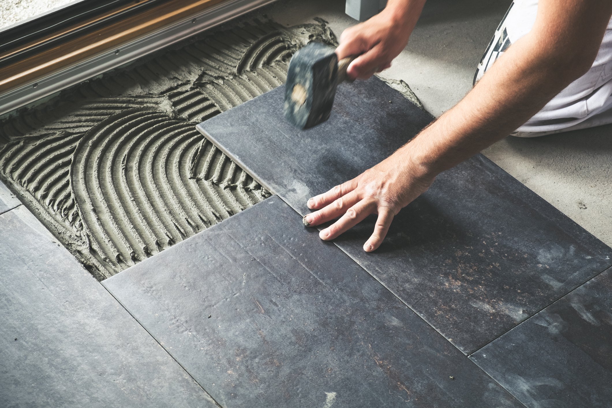 Getty Flooring Man Installing Ceramic Tile
