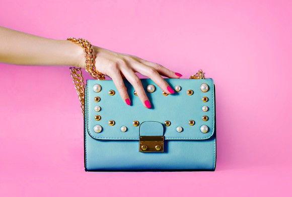 Woman's hand on a handbag