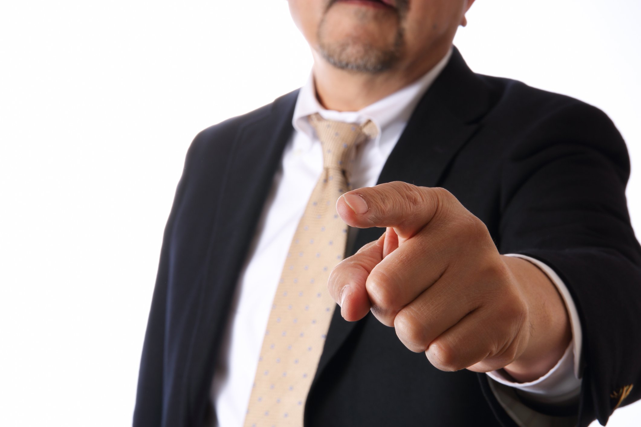 A business man with his finger pointed out