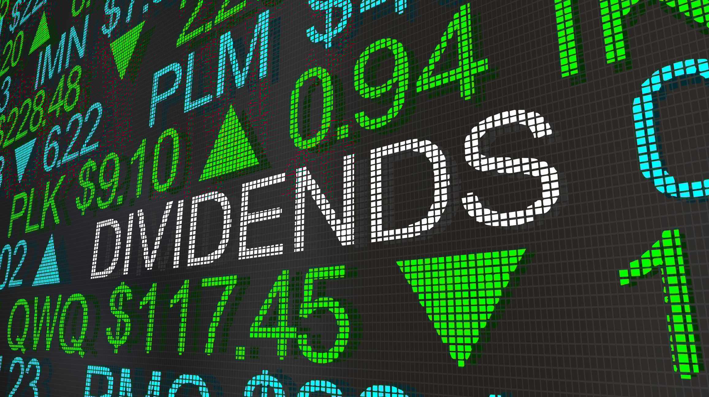 An electronic board with stock tickers says the word dividends in between tickers. 