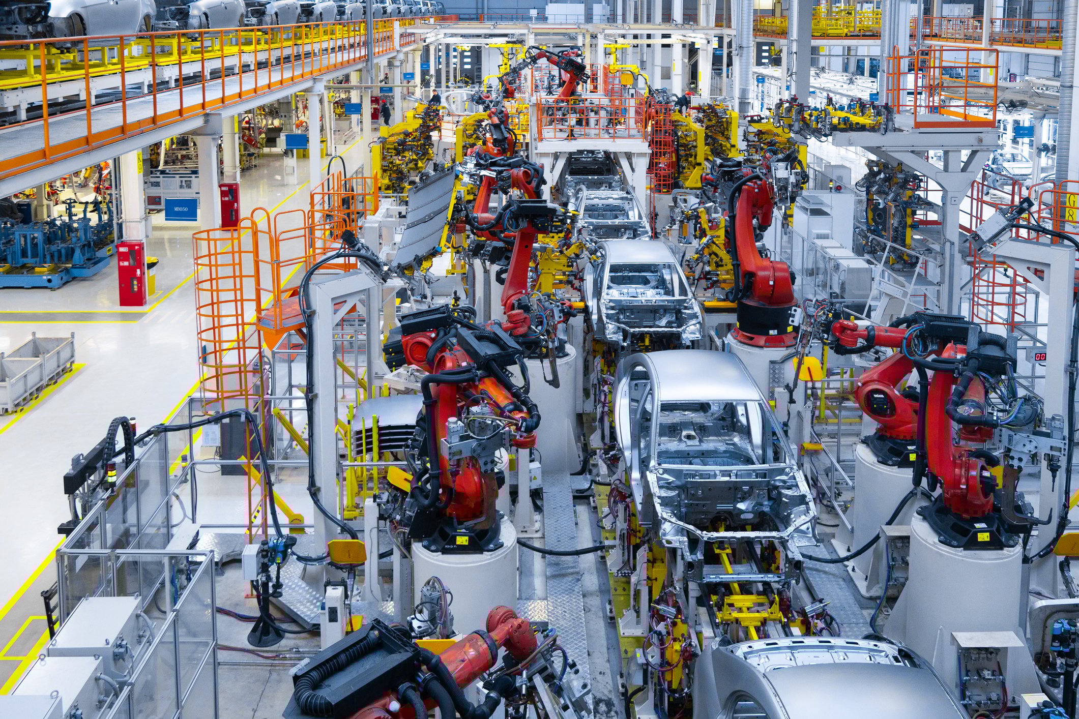 A factory floor featuring substantial robotics and automation.