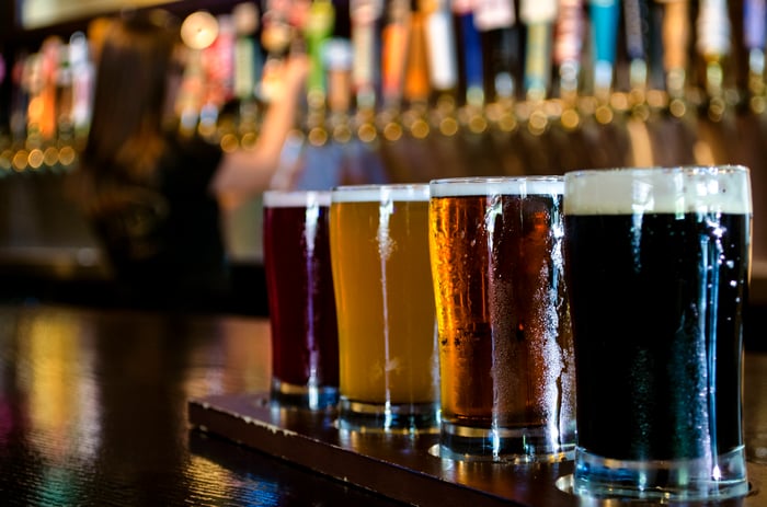 A flight of craft beers on a bar