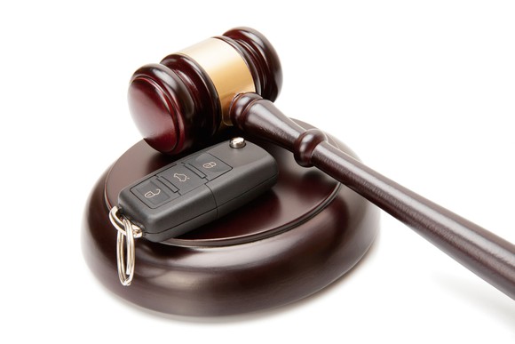Gavel and set of car keys.