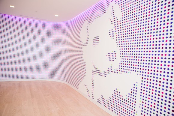Mosaic wall at Datadog headquarters featuring the company's dog mascot.