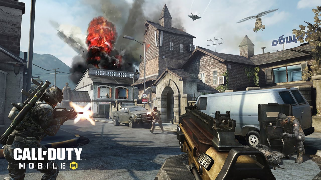 A first-person view of a character holding a gun and looking at a battleground in Call of Duty: Mobile.