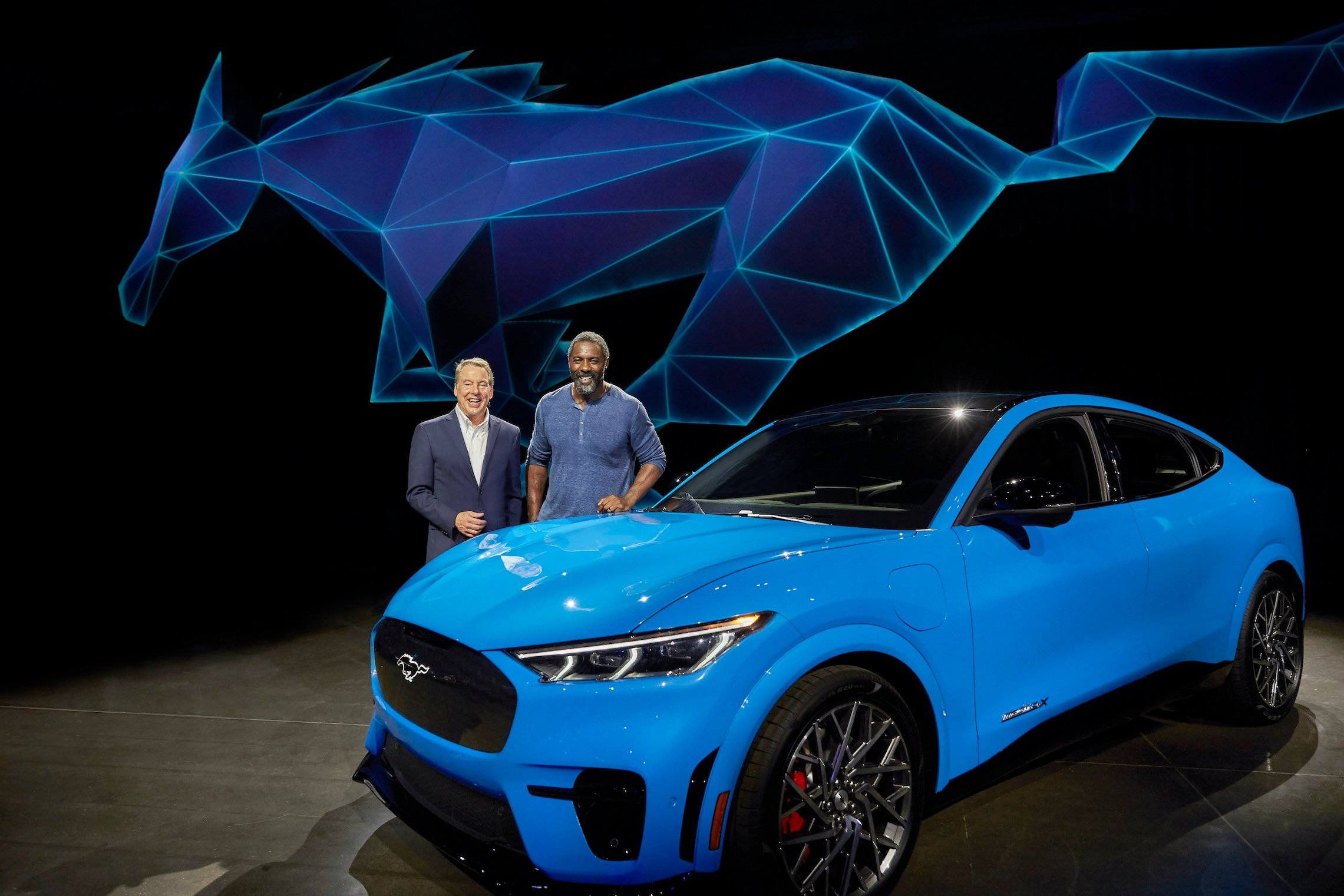 A bright-blue 2021 Ford Mustang Mach-E, a high-performance electric crossover SUV.