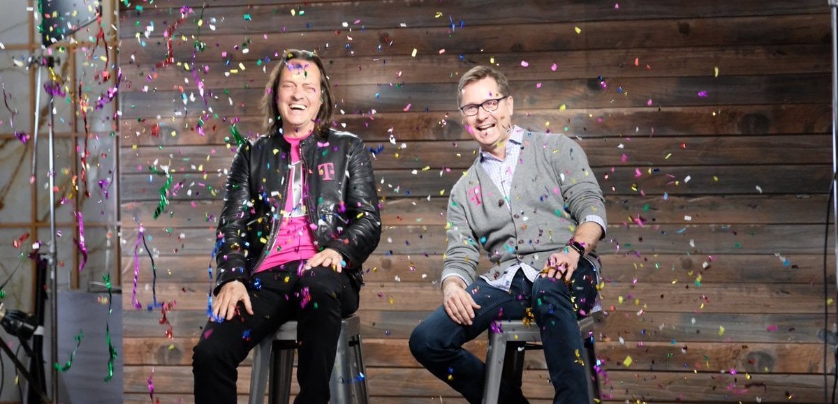John Legere and Mike Sievert smiling with confetti